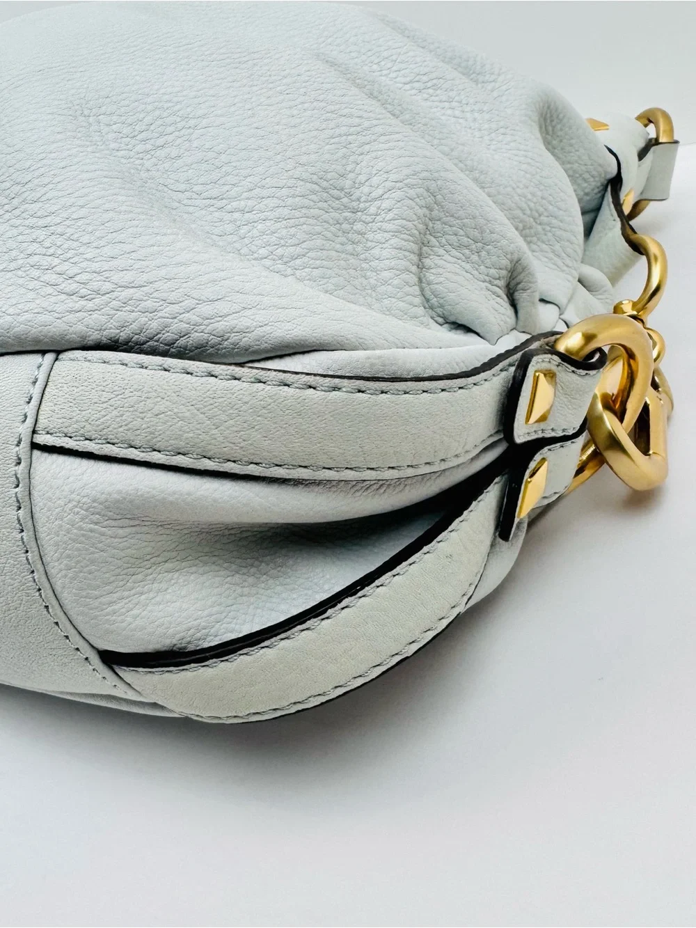 B. Makowsky Leather Ivory Hobo handbag. Gold-tone stud accent hardware.